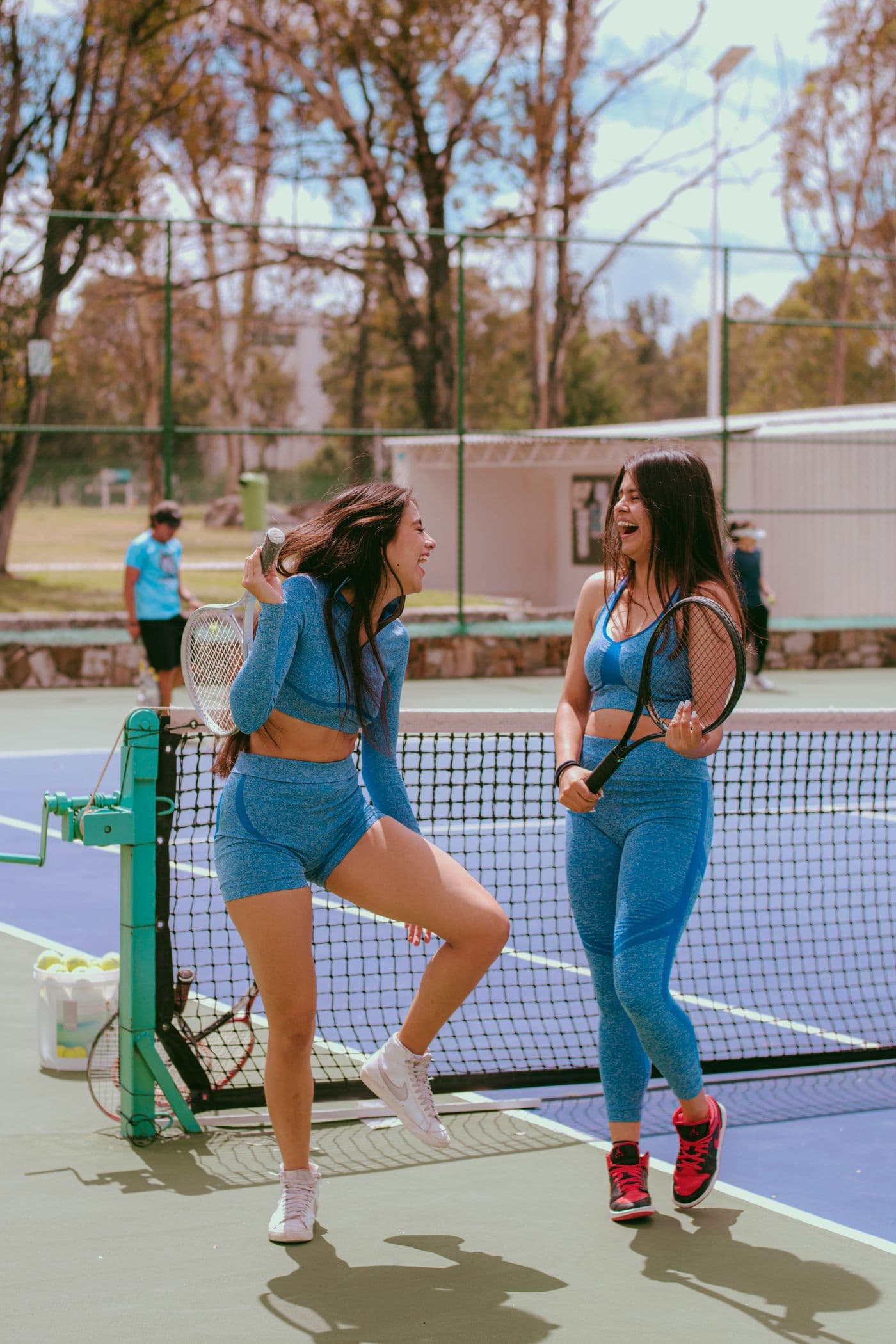 Two friends enjoying a game of tennis